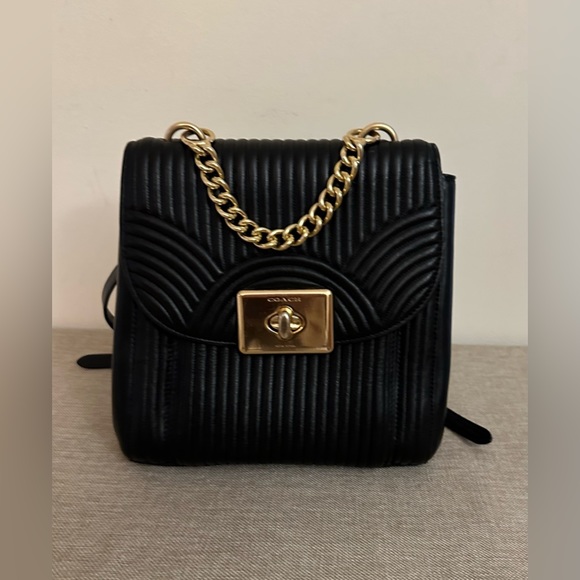 Coach Handbags - Coach art deco quilted Cassidy black leather backpack EUC